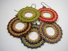 "Boho - Hippie Earrings offered in 5 Colors. Made  with 11/0 & 8/0 Round Toho seed beads, these earrings reflect a care-free style and is  lovely for beach and summer wear.  They are made with warm  earth colors. They are 2 1/2\" from the top of the ear wire, and 1 3/4 circle\". The earwires are stainless steel 21 gage. The Colors are lime green, brown, red, blue, violet." Earth Colors, Hippie Earrings, Earrings Round, Earrings Hoop, Green Earrings, Seed Bead Earrings, Large Earrings, Bead Earrings, Round Earrings