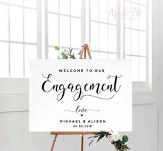 an easel with a sign that says welcome to the engagement