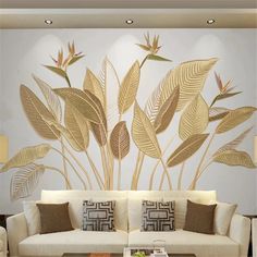 a living room with white couches and large wall mural