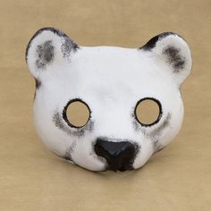 Cute and innocent, this polar bear mask exudes the charm of the cold weather giant. Marcilio Barroco crafts the mask of leather and paints it by hand, expertly conjuring the polar bear's beauty. Bear Therian, Polar Bear Mask, Therian Mask Ideas, Polar Bear Face, Deer Mask, Panda Mask, Felt Animal Masks, Fnaf Crafts, Bear Mask