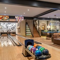 a bowling alley with several colorful bowling balls