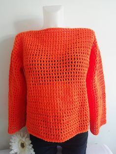 Orange mesh crochet Sweater, Crochet Top, It a lovely colour, looks great with  skirt or trousers Made from Cygnet chunky yarn  Size:          12-14 UK (Medium )          40-42 EU(Medium)            8-10 US (Medium) Loose fitting- across bust: 21" = 42" all around  bust Full length 21" Sleeve length 23" Handmade from Cygnet Chunky yarn Material: 100% Acrylic  Machine warm wash 40oC Hand warm wash 40oC Cold rinse, short spin Do not wring, cool iron Mesh Sweater Crochet, Mesh Crochet Sweater, Mesh Crochet Top, Orange Jumper, Orange Jumpers, Mesh Crochet, Mesh Sweater, Crochet Jumper, Mesh Tops