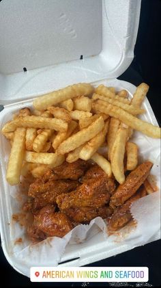 chicken wings and french fries in a styrofoam container