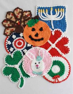 an assortment of crocheted patches with pumpkins, flowers and candles on them