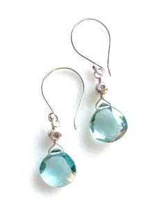 "Gorgeous 10-11mm faceted high quality aquamarine heart briolette earrings in sterling silver or gold vermeil.  Beautiful March birthstone jewelry! These are lovely translucent Aqua blue lab created hydro quartz gemstones wire wrapped in .925 sterling silver on handcrafted sterling silver French hooks. Earrings measure 1 3/8\" long.   Matching solitaire aquamarine heart briolette necklace is also available in my shop. Both come in choice of silver or gold. A beautiful March birthday gift for som Aqua Marine Earrings, Briolette Earrings, Briolette Necklace, March Birthday Gifts, March Birthday, Quartz Gemstones, March Birthstone Jewelry, Aquamarine Earrings, March Birthstone