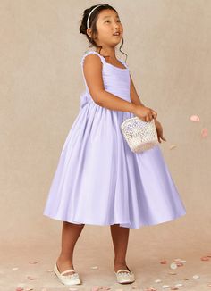 Let your flower girl have fun walking down the aisle while tossing petals in our Matte Satin A-line dress, Cutie Pie. Her square neckline is ruched beautifully and has elastic straps. The back ties into a beautiful bow while the gathered skrit is perfect for twirling an dancing. This dress is not only perfect for a flower girl at a wedding but also versatile enough for other special occasions. Flower Girl Dresses Older Kids, Pastel Flower Girl Dresses, Flower Girl Dresses Lavender, Flower Girl Dresses Purple, Purple Flower Girl Dresses, Lavender Flower Girl Dress, Satin Flower Girl Dresses, Lilac Flower Girl Dresses, Purple Flower Girls