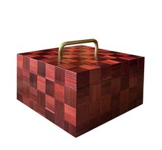 a large wooden box with a handle on the top is made out of red and brown squares