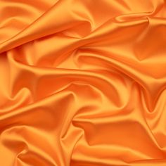 an orange satin fabric with very soft folds