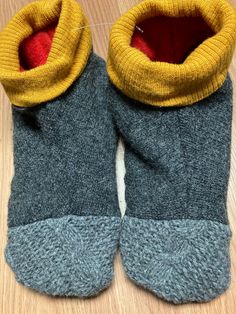 "These slippers are the coziest. They are made from  recycled wool sweaters (washed/felted, taken apart and redesigned),  are fleece lined and even have recycled leather on the sole for a non-slip bottom. The cuff ensures that they keep ankles warm, and don't slip off as some slippers do!   These are a size Large which will fit a foot sizes 9-10.5;they do stretch, since they're made out of sweaters! The bottom sole measures about 11\" long. you can even wash these; lay flat to dry.  I can also m Sweater Slippers, Recycled Wool Sweater, Recycled Leather, Wool Sweater, Wool Sweaters, Lay Flat, 9 And 10, Destiny, Clothing Items