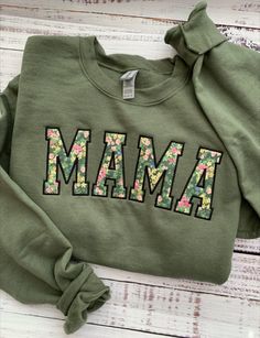 Mama Sweatshirt-Custom Embroidered Sweatshirt-Mother's Day Gift-Custom Sweatshirt-Crewneck Sweatshirt-Gift for Mom-Mom Gift-Mom Sweatshirt-Gift for Her-Mama Custom Embroidered MAMA Sweatshirt makes for a great gift for Mom.  This custom sweatshirt also makes for the perfect Mother's Day Gift. This crewneck sweatshirt is super soft, unisex in size and makes for a spectacular gift for her (or anyone). Main photo shows Military Green sweatshirt with Green Floral fabric and Black satin stitch embroi Casual Mother's Day Sweatshirt With Embroidered Graphics, Casual Embroidered Sweatshirt For Mother's Day, Mother's Day Casual Sweatshirt With Embroidered Text, Momma Embroidered Sweatshirt, Green Mama Sweatshirt, Embroidery Outline, Green Floral Fabric, Green Sweatshirt, Sweatshirt Crewneck