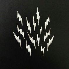 a black background with white lightnings drawn on it