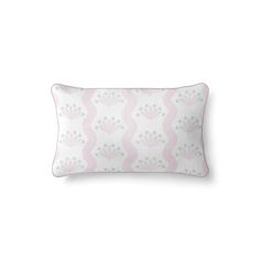 a pink and white pillow on a white background