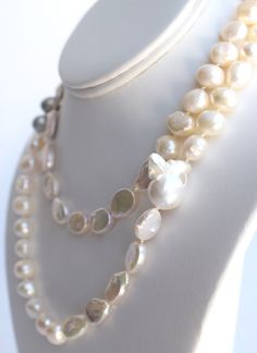 Materials- 9-10 mm near-round freshwater pearls, 11-14 mm oval coin freshwater pearls, (1) XL rare nucleated baroque pearl, 14k gold-filled bead clasp SizeLength: 37", can be worn long or doubled Each piece is limited edition and meticulously handcrafted by me in my Florida home studio. Please allow 3-5 days for production. Luxury Classic Pearl Necklace With Round Beads, Cheap Statement Pearl Necklace With Round Beads, Luxury Pearl Necklace With 8mm Round Beads, Luxury Pearl Necklace With Round Beads, Luxury Round Beads Pearl Necklace For Festivals, Luxury Pearl Necklace With Lobster Clasp And Round Beads, Luxury Pearl Necklace With Colorful Round Beads, Luxury Bohemian Pearl Necklace With Round Beads, Luxury Pearl Drop Necklace With Round Beads