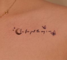 the back of a woman's shoulder with a tattoo saying i love you to the moon and stars