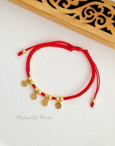 "Red String Bracelet/Anklet, Red Lucky Bracelet with Gold-Plated Wishes and Good Fortune 平安喜乐 Charm, Red Protection Bracelet, Lunar New Year Bracelet Gift Material: - 4 pcs 18k gold-plated double sides Chinese character good fortune charm (6mm each) \"平安喜乐\" means \"Peace, Safety, Happiness, Joy\" - 18k gold-plated spacer beads (4mm) - 0.8mm professional woven waxed red string ♥ Packaging: All jewelry comes in a beautiful and careful packaging. ❖ The bracelet is made to order, as the bracelet length must be based on your wrist size. All orders are final sale as they are custom bracelets. Please double check your wrist size before ordering ❖ BRACELET SIZE  We make all our bracelets to actual \"bracelet size\" or \"bracelet length\" (not \"wrist size\") Select your preferred bracelet Size/le Affordable Handmade Red Braided Bracelets, Red Adjustable Bracelets For Festivals, Handmade Red Charm Bracelet, Red String Of Fate, Red String Bracelet, Lucky Bracelet, Red String, Protection Bracelet, Classy Jewelry