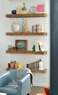 a living room filled with furniture and bookshelves