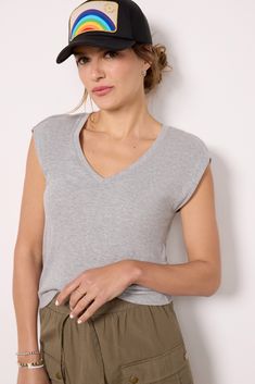 A strong shoulder design takes this Michael Stars tee up a notch, crafted in soft rib knit fabric with a v-neckline and semi-relaxed fit. Paired with skirts, jeans, or shorts, it will be your new favorite staple. Stretch V-neck Top With Ribbed Neckline, Trendy V-neck Top With Ribbed Neckline, Stretch V-neck Tops With Ribbed Neckline, Casual Tank Top With Ribbed Neckline, V-neck Top With Ribbed Neckline, Basic V-neck Loungewear Tops, Casual Stretch V-neck Top For Everyday, Casual V-neck Loungewear Top, Casual V-neck Tank Top For Loungewear