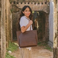 Our everyday tote bag is steady enough for your laptop and every day needs. It also provides the versatility your wardrobe is missing. You'll love the large exterior pocket that allows you to easily access important documents. FREE SHIPPING (US Domestic) Handmade in India Materials: 100% genuine, full grain (and super soft) leather, hand block printed cotton lining Dimensions: 15 in. L x 12.5 in. H x 3.5 in. D at base; non-adjustable 26 in. handle (12.5-inch drop) Tote features one large exterio Everyday Leather Lined Tote Laptop Bag, Everyday Leather-lined Laptop Tote Bag, Brown Weekender Bag For Everyday Use, Everyday Laptop Bag With Leather Lining, Everyday Laptop Bag With Leather Lining And Tote Shape, Everyday Use Tote Laptop Bag With Leather Lining, Daily Use Laptop Tote Bag With Leather Lining, Leather Lined Tote Laptop Bag For Daily Use, Daily Use Leather Lined Tote Laptop Bag