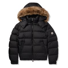 Moncler's 'Maya' jacket is instantly recognisable by its boxy silhouette and faux fur-trimmed hood. Made from black shell and filled with insulating down, it's detailed with a patch pocket and emblem at the sleeve. The side zip-pockets are roomy enough to hold all of your essentials. Luxury Outerwear With Faux Fur Trim And Down Material, Luxury Down Outerwear With Double-lined Hood, Luxury Parka With Faux Fur Trim, Luxury Puffer Jacket With Double-lined Hood, Luxury Down Outerwear With Detachable Hood, Luxury Puffer Jacket With Padded Collar, Luxury Puffer Jacket With Padded Collar For Cold Weather, Luxury Fur Coat For Cold Weather, Luxury Hooded Parka With Faux Fur Trim