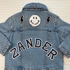 "Our personalized jean jackets are OH SEW DREAMY! These one-of-a-kind jackets are amazing as gifts, holidays and everyday wear. We recommend that you size up for longevity. This customized jean jacket comes with two options of personalization: name on shoulders and up to 3 patches on back or name on back and up to 3 patches on back. If you would like to add more than 3 patches on the back, additional patches can be purchased here for $4 per patch. https://www.etsy.com/listing/1319349068/add-more-patches-please **If you would like to see a picture of the layout before I sew, please send me a note with your order. Otherwise, I will use the information you provide to complete the order** LETS GET DREAMY JACKETS: Each jacket is made custom for you or your loved ones! Please know that your jack Customizable Blue Denim Jacket, Fun Cotton Denim Jacket For Fall, Customizable Blue Denim Jacket With Long Sleeves, Customizable Denim Jacket For Fall, Customizable Blue Denim Jacket For Spring, Customizable Denim Jacket For Spring, Customizable Trendy Denim Jacket For Spring, Trendy Customizable Long Sleeve Denim Jacket, Spring Customizable Denim Jacket