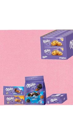 three boxes of cookies on a pink background