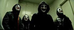 three people wearing masks standing next to each other in a room with no one around them