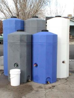 three water tanks sitting next to each other