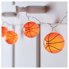 three basketball lights hanging from a chain