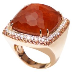 18 karat rose gold ring with layered smokey quartz, agate and mother of pearl as a center stone, set with 0.71 carat orange sapphires and 0.51ct diamonds. Made in Italy and by craftsman that create jewelry that is modern, sophisticated, and bold. The natural orangy-brown gem is prong-set, surrounded by a double halo of diamonds and orange sapphires and set in a stunning handmade 18kt rosegold mounting. This Italian design ring is a European size 53 which is a US size 6.5 This ring is in new cond Double Halo, Orange Sapphire, Smokey Quartz, Cocktail Rings, Italian Design, Rose Gold Ring, Prong Setting, Ring Designs, Or Rose