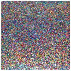 colorful sprinkles are scattered over a white background in this image, there is a