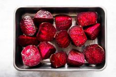 beets in a metal pan on a white surface