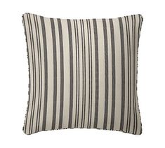 a black and white striped pillow on a white background