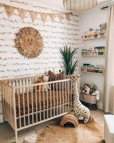 a baby's room with a giraffe statue in the corner