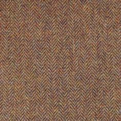 a close up view of a brown and tan tweed fabric