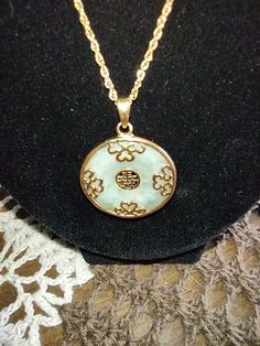 Formal Jade Necklace With Round Pendant, Vintage Jade Round Pendant Jewelry, Antique Engraved Jade Jewelry, Vintage Jade Pendant Jewelry, Vintage Jade Gemstone Jewelry, Antique Round Jade Jewelry, Antique Jade Jewelry For Anniversary, Collectible Jade Pendant Jewelry, Antique Jade Jewelry As A Gift