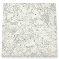 a white marble tile with green and gray speckles