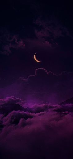 the moon is shining in the night sky above some clouds and dark purple hues