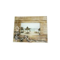 a wooden frame with a beach scene on it