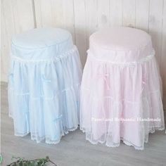 two white and pink tulle skirts sitting next to each other