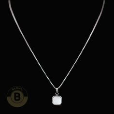 This necklace embodies modern masculinity with a solid chain that oozes power and panache. The square stone pendant? It's a symbol of order, stability, and honesty. This stunner is the perfect blend of ruggedness and refinement for the contemporary gentleman. Specifications: Metal: Stainless SteelFinish: PolishedPendant Weight: 6gPendant: 0.59"x0.59" | 15mmx15mm When it comes to men's necklaces, stainless steel offers strength, shine, and street cred. Stainless Steel necklaces interlock metal ri Square Stone Pendant, Diamante Bracelet, Leather Choker Necklace, Box Chain Necklace, Square Stone, Pearl Choker Necklace, Natural Stone Bracelets, Jewelry For Men, Chain Choker Necklace