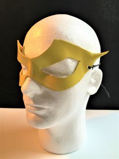 DESCRIPTIONSpeed around town in a yellow mask for supervillian Professor Zoom, Reverse Flash! Great for Halloween or Marvel Firestar at Comicon. **We also sell this mask with a red lightning bolt!** Or, perhaps you need a plain yellow mask for Masquerade Ball. Get this style in any color. Waterproofed leather, glossy or matte finish, & several choices to affix the mask (cord, elastic, ribbon, waterproof cord, stick, or no holes for adhesive). Measurements: 3.25" high x 10.5" wide (tallest &a Superhero Masks For Cosplay Events, Yellow Costume Accessories For Halloween Cosplay, Yellow Halloween Cosplay Costume Accessories, Superhero Mask For Cosplay, Comic-con Costume Party Mask, Superhero Masks For Halloween Masquerade, Superhero Style Masquerade Masks For Halloween, Superhero Masquerade Mask, Marvel Firestar