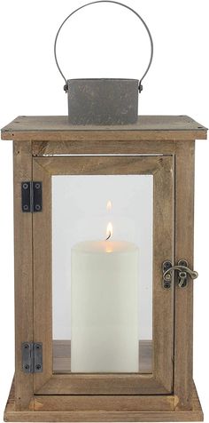 a wooden lantern with a lit candle in it's glass front and metal handle