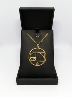 Golden Spiral Pendant A beautiful pendant/necklace with the well know yet mysterious Fibonacci Spiral (Golden Spiral)! The perfect gift for all Men and Women! * Materials/Finishes - Natural (Unpolished and Slightly Textured) Silver 925 - Polished Silver 925 - 22K Gold Plated over Natural Brass - 18K Gold Plated over Polished Brass - 14K Rose Gold Plated over Polished Brass * Pendant Dimensions: 3.3 x 3.0 x 0.2 (cm) ----------------------------------------------------------------------------- IMP Spiral Yellow Gold Necklace For Gift, Gold Spiral Necklace As A Gift, Gold Spiral Necklace For Gifts, Gold Spiral Necklace For Gift, Unique Circular Necklace For Gifts, Handmade Spiral Necklace For Gift, Unique Circle Necklace For Gifts, Unique Gold Spiral Necklace, Fibonacci Necklace