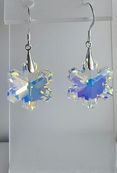 This pair of earrings features Clear AB  Swarovski crystal Snowflakes. The findings are Sterling Silver including fish hook ear wires.  Custom Orders are always welcome! Xmas Earrings, Crystal Snowflakes, Snowflake Earrings, Providence Ri, Diy Home Repair, Home Repair, Fish Hook, Ear Wires, Swarovski Crystal