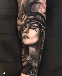 a woman's arm with tattoos on it and an image of her face in the background