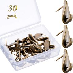 there are several pairs of metal clothes pins in a plastic box with gold numbers on them