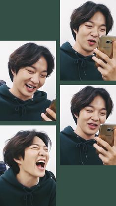 the man is laughing while holding his cell phone in one hand and making a funny face