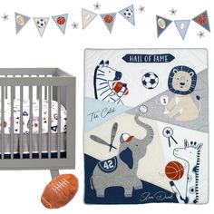 a baby crib bedding set with an elephant, giraffe and basketball theme