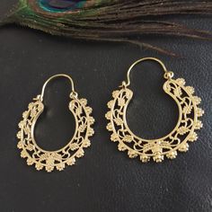 Hoops Earrings in Silvered or Golden Brass Serrated and Openworked. These Earrings are Elegantly Decorated with Openwork Plant and Floral Motifs to Create a Pretty Mandala. The Inner and Outer Perimeter is Serrated to Give these Creoles a More Ethnic Style. These Hoop Earrings are very elegant and they will illuminate your face. Timeless and Lightweight Creoles to Wear Everyday to Give an Ethnic Touch to Your Outfits. They are made from brass. Material: Brass Color: Silver or Gold Length: 4.6cm Width: 3.8cm Thickness: 0.2 cm Weight: 10 Gm (The Pair) Handmade Delivered in a Fabric Pouch Ideal for Gifting To offer or simply treat yourself, do not hesitate! You Can Match Them With This Item: https://www.etsy.com/fr/listing/1356743284/bracelet-adjustable-dore-avec-pierre-semi?ref=listings_mana Festive Brass Hoop Earrings With Intricate Design, Handmade Ornate Hoop Earrings, Ornate Handmade Hoop Earrings, Festive Hoop Earrings With Intricate Design, Festive Brass Hoop Earrings With Ear Wire, Festive Dangle Hoop Earrings With Intricate Design, Intricate Dangle Hoop Earrings For Festive Occasions, Festive Brass Dangle Hoop Earrings, Festival Hoop Earrings With Ear Wire