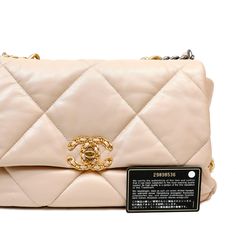 This Chanel Beige Lambskin 19 Bag is in pristine un condition. Released in 2019, the pillowy soft oversized quilts and mixed metals are a beautiful addition to the classic flap family. Neutral beige lambskin is quilted in signature Chanel pattern on a larger scale. Interlocking CC twist lock with gold chain detail secures the front flap. Mixed metal chain straps in silver, ruthenium and aged gold allow for hand or shoulder carry. Fabric lined interior. Dust bag included. Proudly offered from Only s for $7,750.00. Payment by bank wire only. Please email Concierge@onlys.com for additional photos of this item. PBF 12392 Chanel Pattern, Mixed Metal Hardware, Oversized Quilt, Chanel Beige, Ysl Shoes, Versace Bags, Trending Handbag, Neutral Beige, Classic Flap